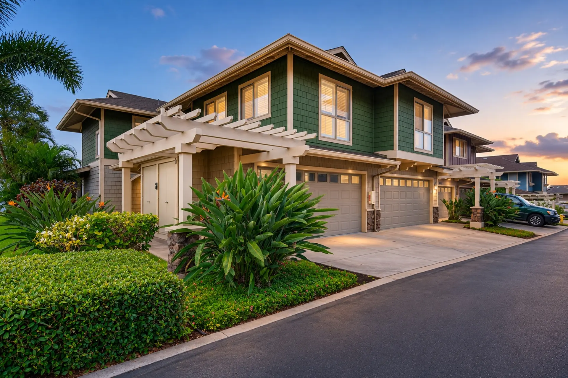 Luxury green Oahu residence photographed at dusk with tropical landscaping